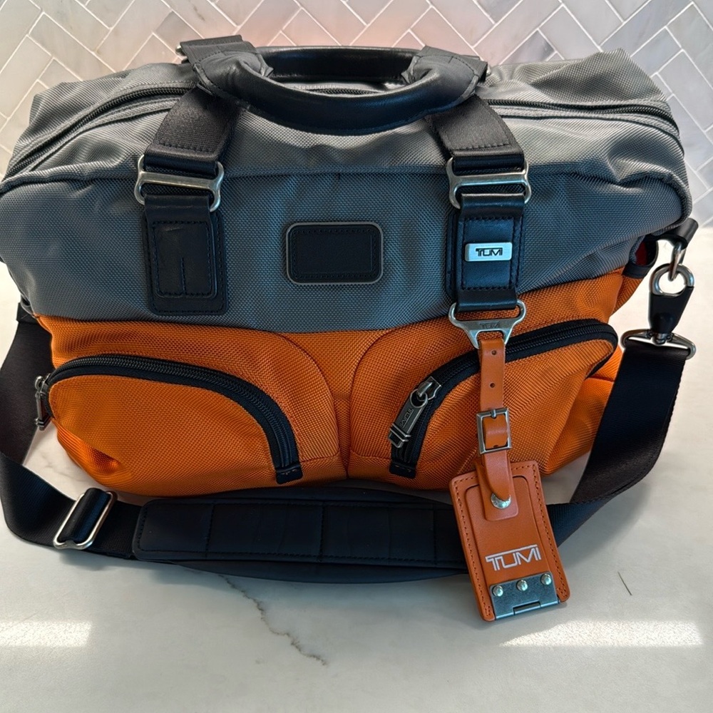 Tumi Orange and Gray Travel Bag with Multi-Compartment Design